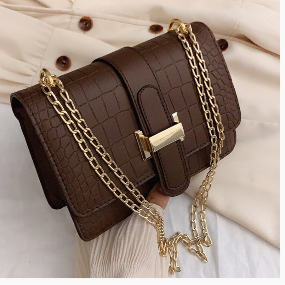 Brown leather dressy purse with gold chain shoulder strap with inside pockets